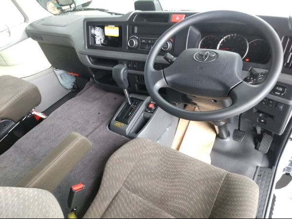 Stock No. BT1045 Used Toyota Coaster Bus 2026 Model photo: Cockpit view image (driver view picture)